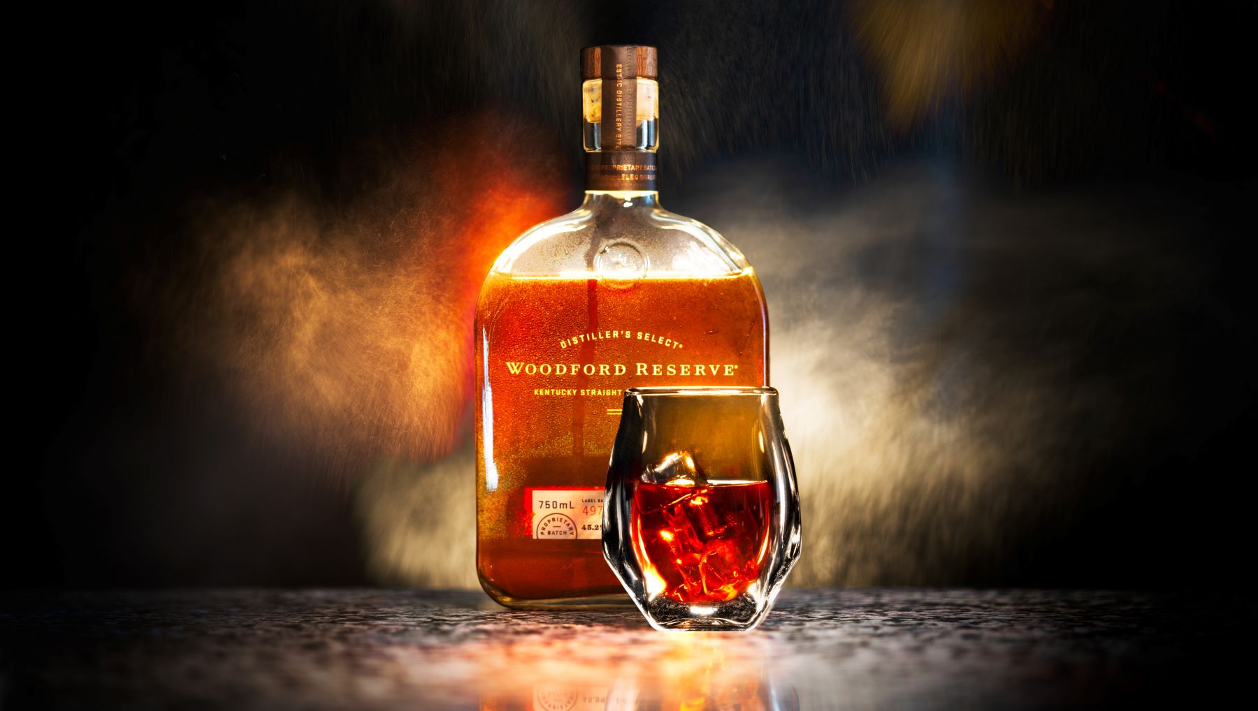Bottle and glass of Woodford Reserve bourbon